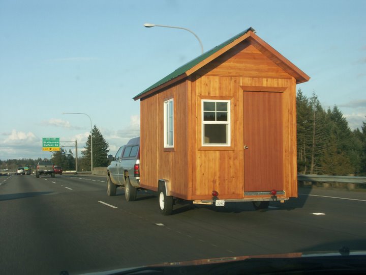 tiny-house-on-wheels-driving-down-the-highway