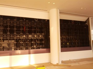 Video Wall Display with pivot access overhead door