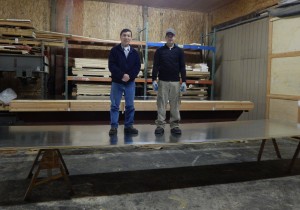 20 ft x 5 ft x 1 in galvanized steel panel high strength demonstration with 2 men standing on lightweight honeycomb panel 375 lbs